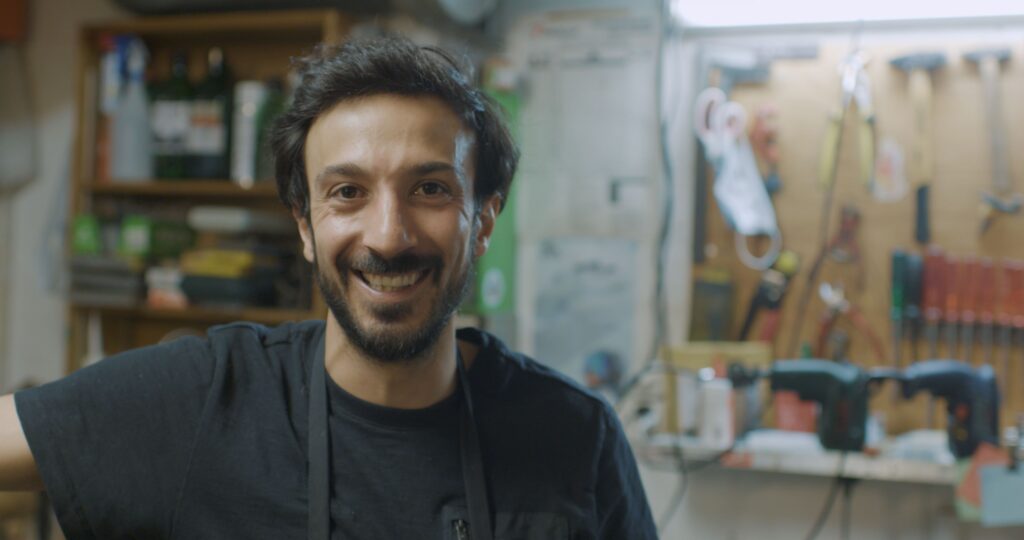 The face of a happy Mustafa Ceylan in the ski shop.